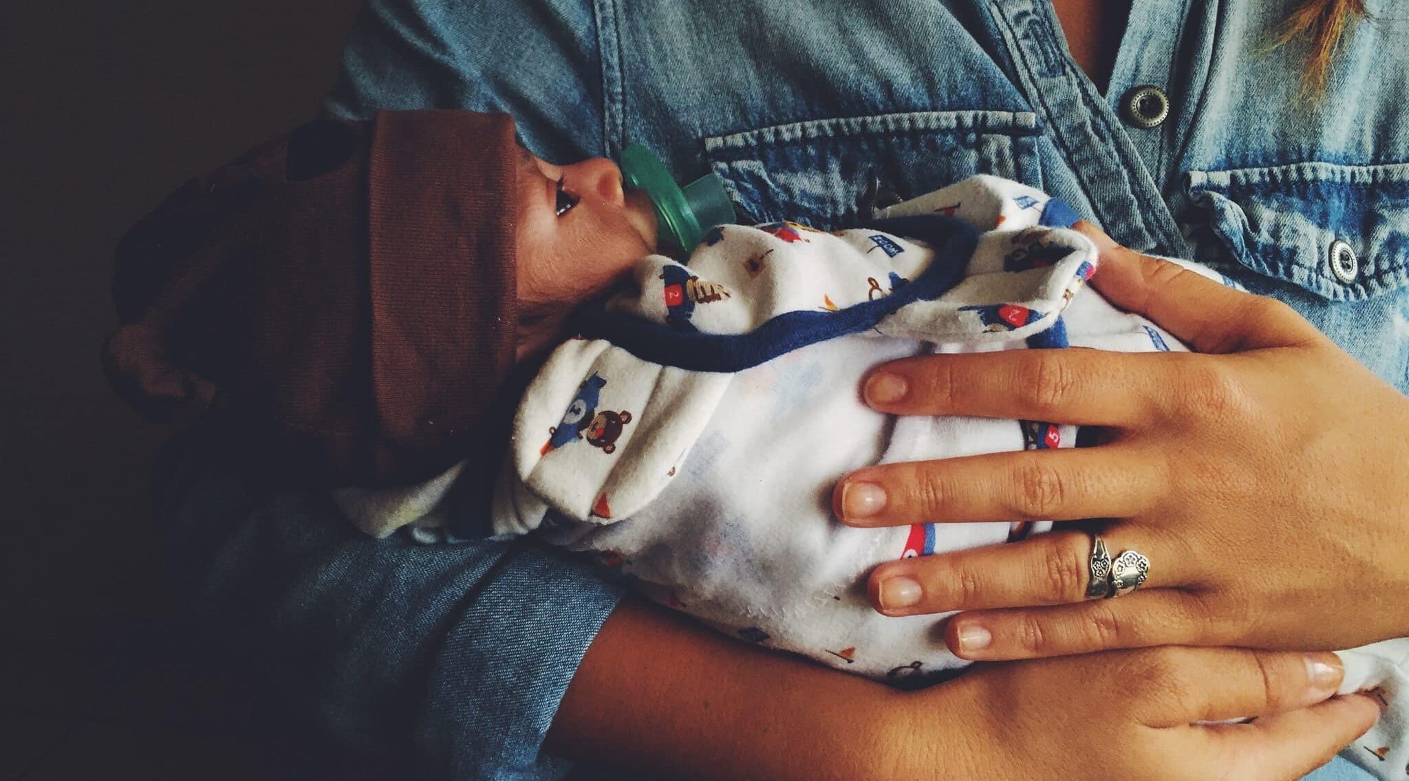 holding a newborn